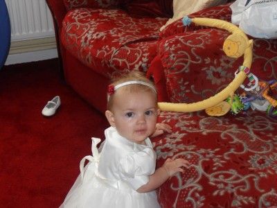 Below Baby Emilie aged 6 months wearing her yellow butterfly headband 