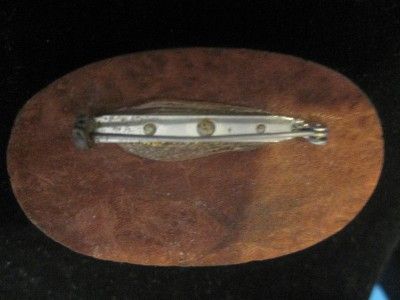 Vintage, deeply carved, daisies in plastic on wood brooch  rare book 